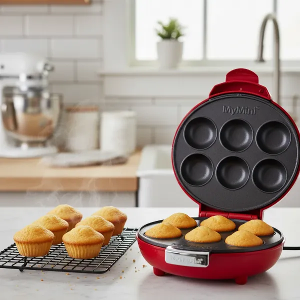 Freshly baked, perfectly uniform mini cupcakes cooling after being made in the MyMini Cupcake Maker.